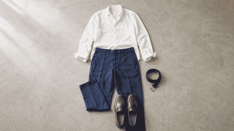 men's summer office outfit flat lay with white lightweight cotton oxford shirt linen blend trousers and leather loafers