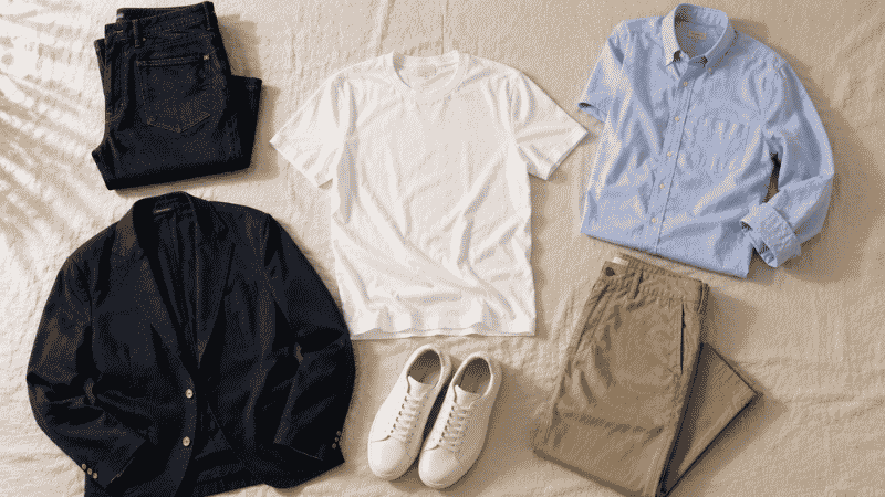 men's casual outfit ideas flat lay showing white t-shirt dark jeans oxford shirt chinos navy blazer and white sneakers for everyday situations